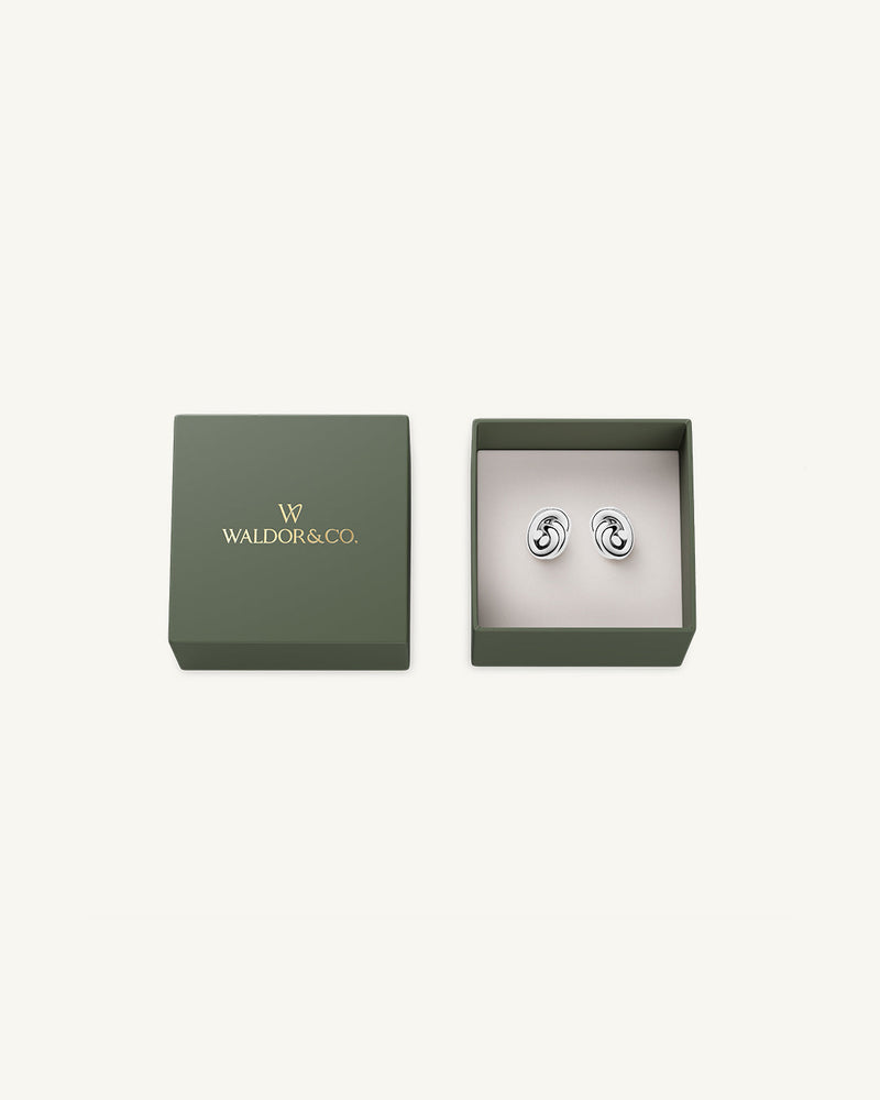 Earrings in silver plated-316L stainless steel from Waldor & Co. The model is Dual Knot Earring Polished.