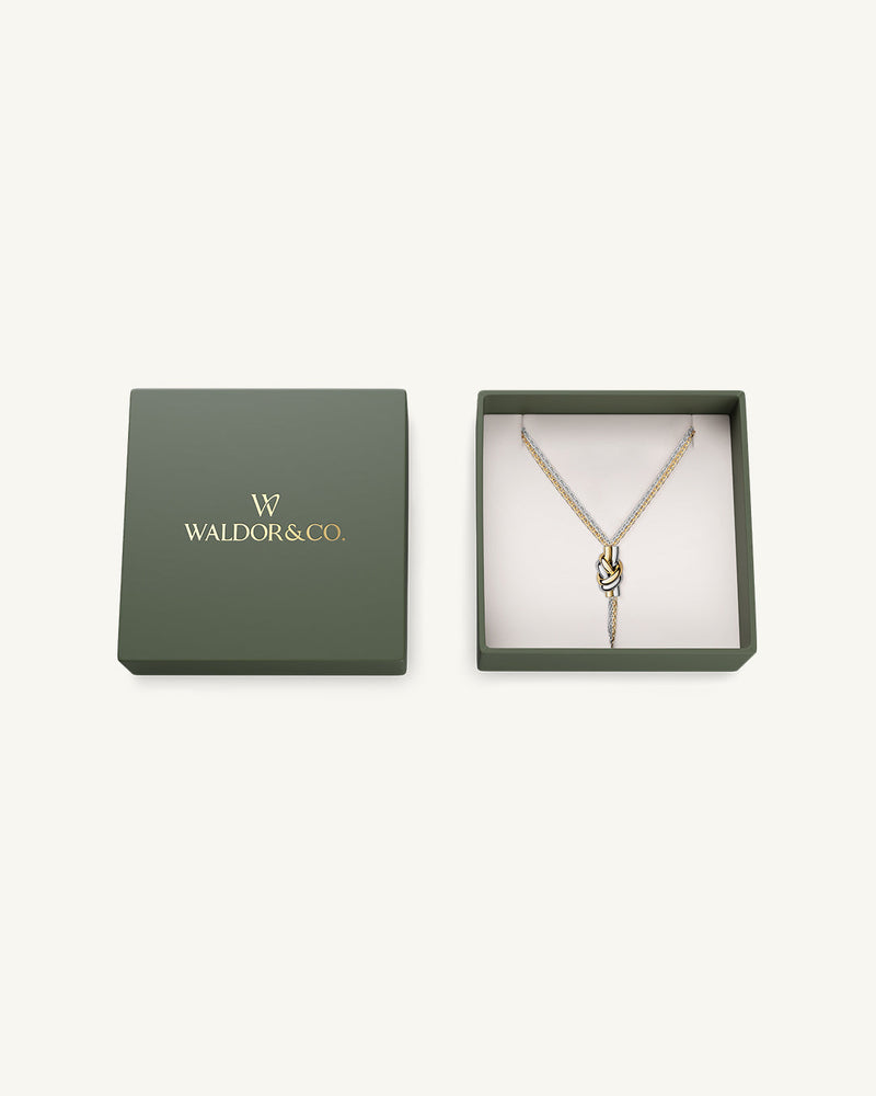 Necklace in silver and gold plated-316L stainless steel from Waldor & Co. The model is Dual Knot Necklace Polished.