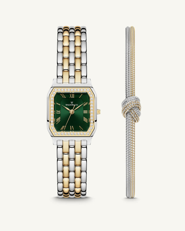 A square womens watch in Rhodium-plated 316L stainless steel from Waldor & Co. with emerald green dial. Bezel with premium crystals. Diamond Cut Sapphire Crystal glass dial. Seiko movement. The model is Eternal 22 Bellagio Pavè.