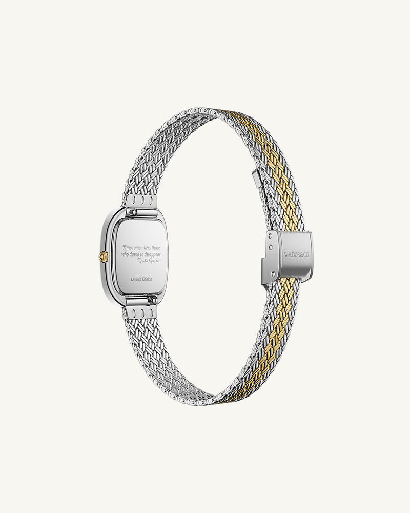 An oval womens watch created under exclusive license from the Greta Garbo™ estate. Featuring a silver sunray dial with gold Roman numerals, framed in a dual-tone case. Seiko movement.