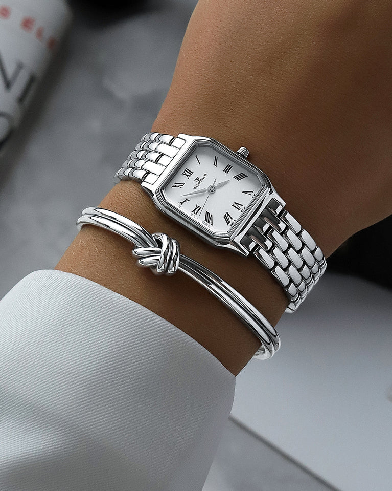  A square womens watch in Rhodium-plated 316L stainless steel from Waldor & Co. with white Diamond Cut Sapphire Crystal glass dial. Seiko movement. The model is Eternal 22 Bellagio.