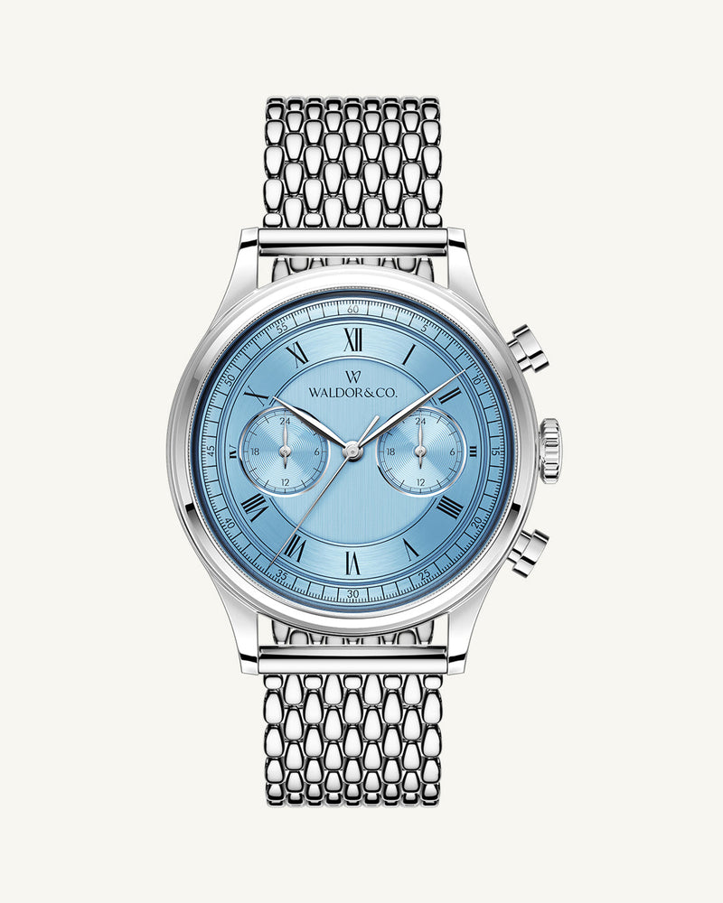 A round mens watch in rhodium-plated silver from Waldor & Co. with light blue sunray dial and a second hand. Seiko movement. The model is Avant 42 Cap Mala 42mm.