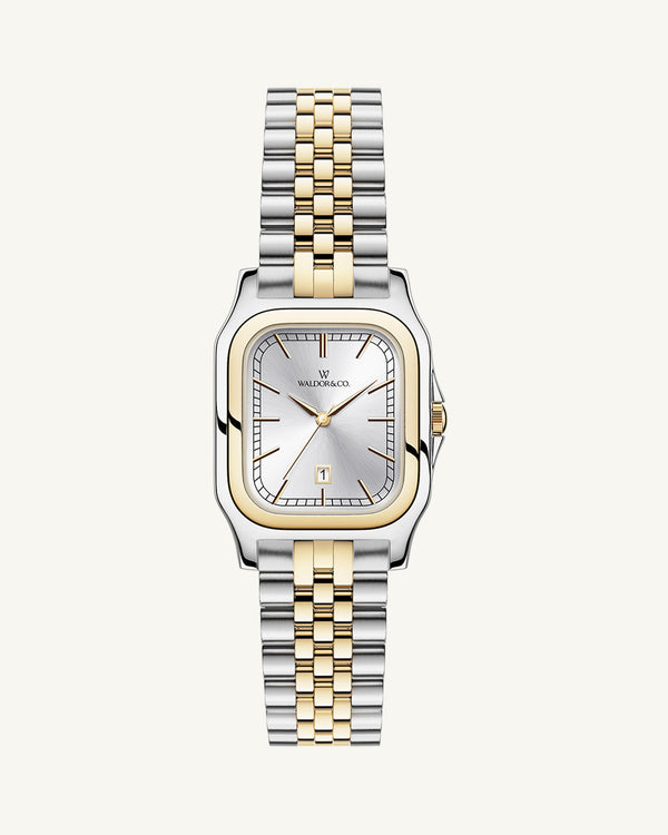 A square womens watch in silver and 14k gold from Waldor & Co. with silver sunray dial and a second hand. Seiko movement. The model is Delight 32 Chelsea 28x32mm.