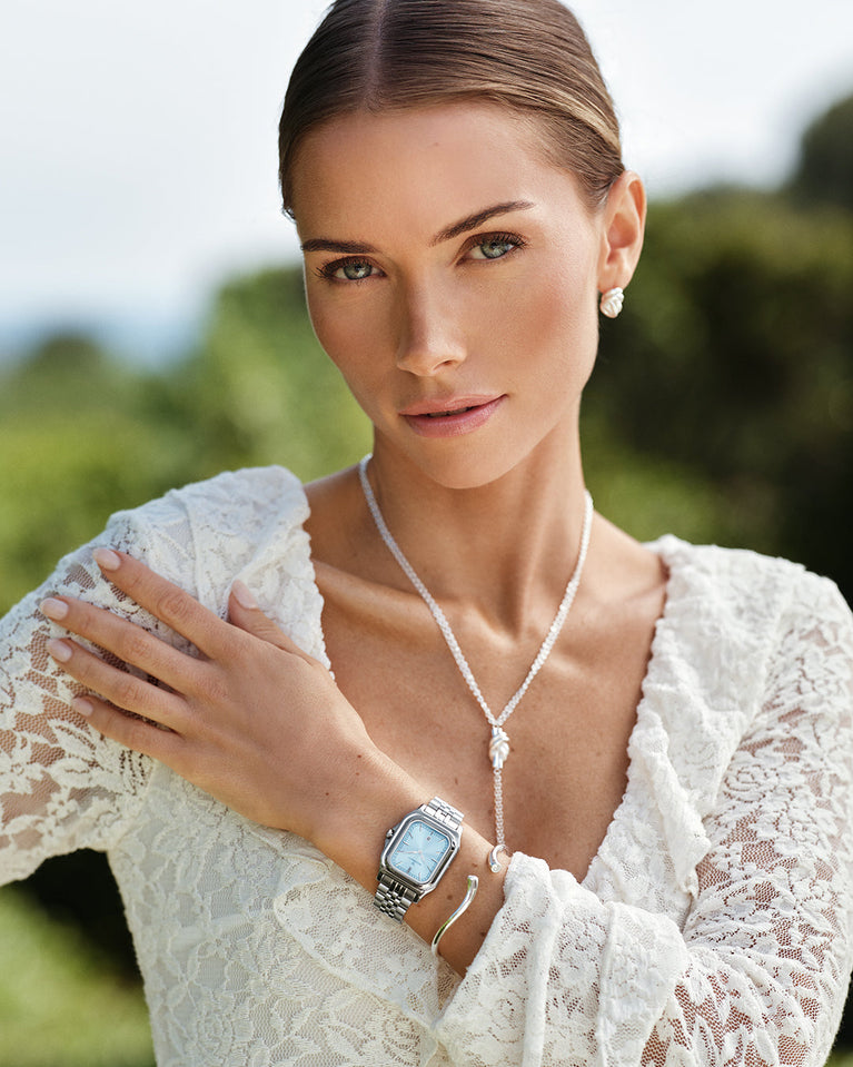  A polished stainless steel bangle from Waldor & Co. One size. The model is Delight Bangle.