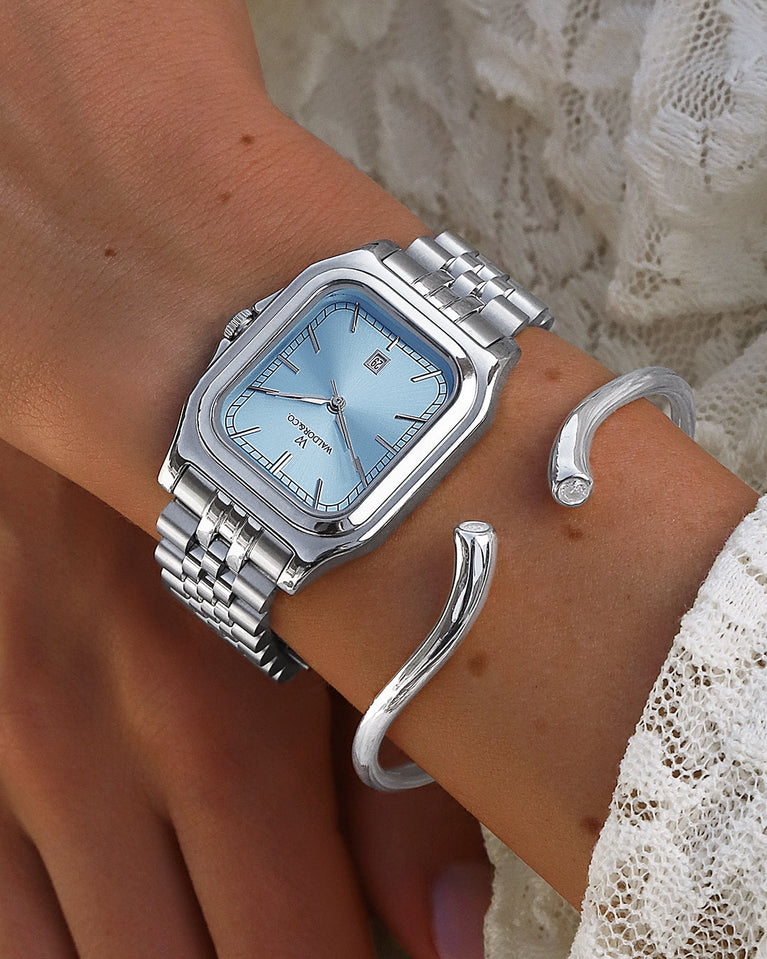  A polished stainless steel bangle from Waldor & Co. One size. The model is Delight Bangle.