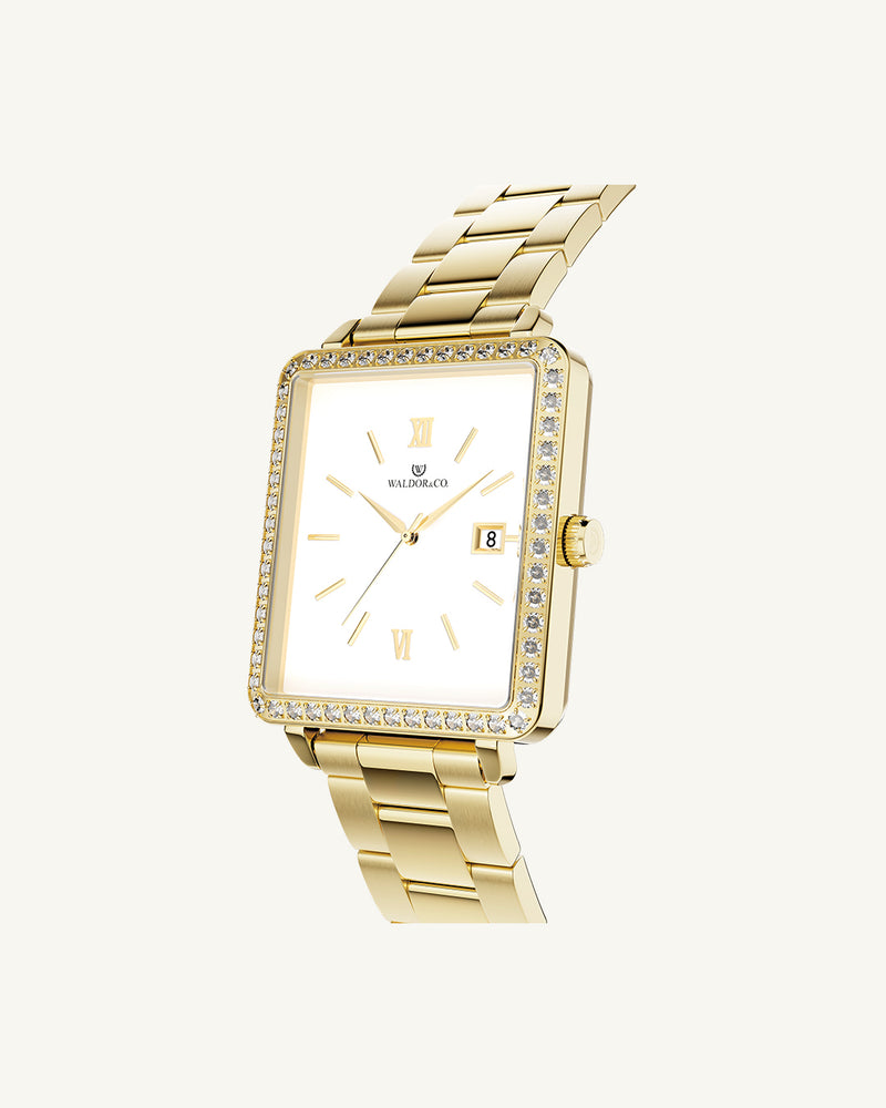 A square womens watch in 22k gold-plated 316L stainless steel with stones from WALDOR & CO. with black sunray dial and a second hand. Seiko VJ22 movement. The model is Delight 32 Mayfair 28x32mm.