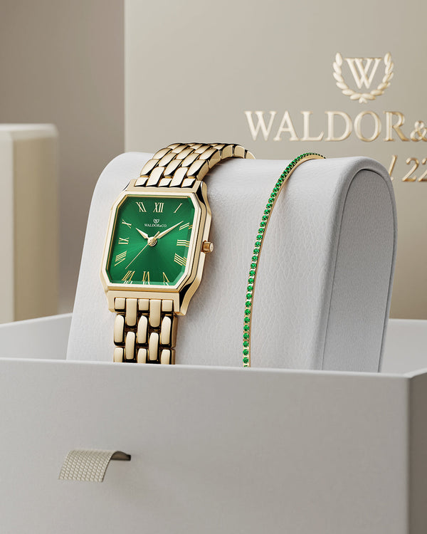 lifestyle_image,A square womens watch in 22k gold from Waldor & Co. with green Diamond Cut Sapphire Crystal glass dial. Seiko movement. The model is Eternal 22 Bellagio.