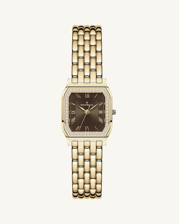 A square womens watch in Rhodium-plated 316L stainless steel from Waldor & Co. with a deep brown dial. Bezel with premium crystals. Diamond Cut Sapphire Crystal glass dial. Seiko movement. The model is Eternal 22 Bellagio Pavè.