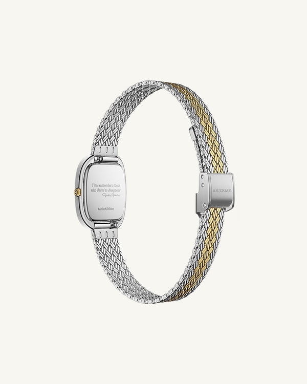 An oval womens watch created under exclusive license from the Greta Garbo™ estate. Featuring a silver sunray dial with gold Roman numerals, framed in a dual-tone case. Seiko movement. 