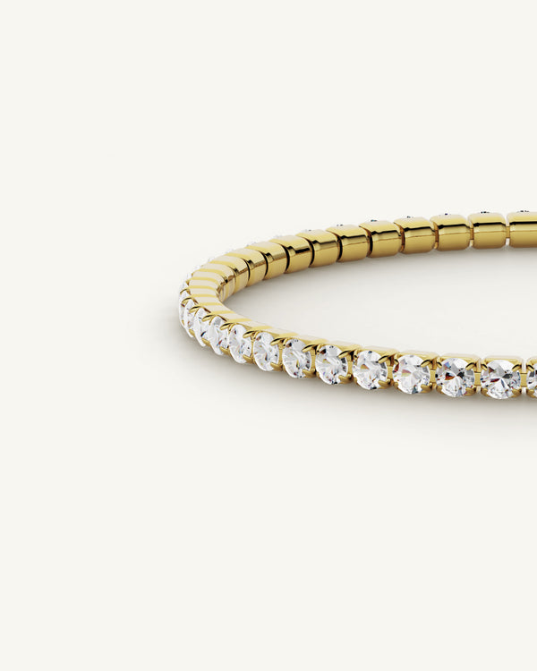 A polished stainless steel chain in 14-k gold plated from Waldor & Co. One size. The model is Tennis Chain Polished