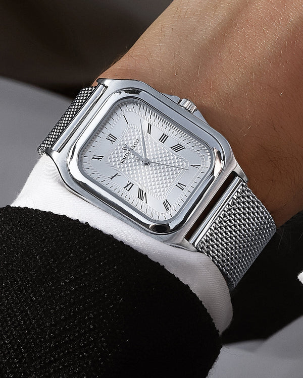  A square mens watch in silver from Waldor & Co. with silver dial and a second hand. Seiko movement. The model is Montel 40 Camogli.