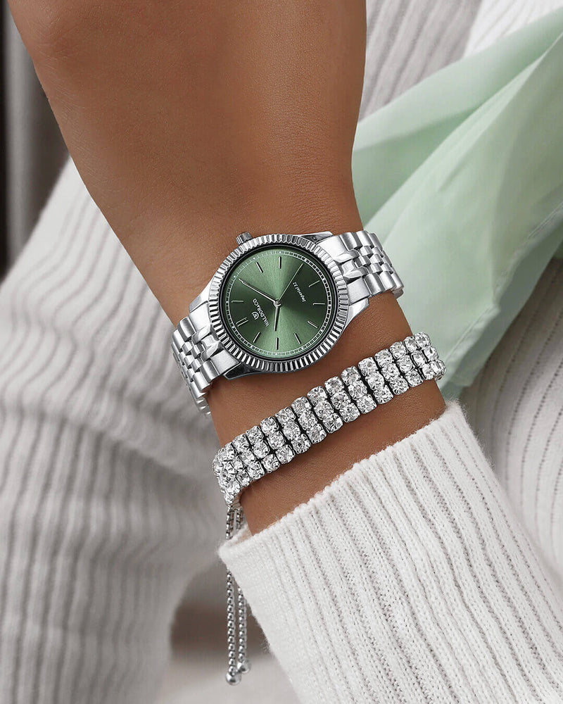 A round womens watch in silver from Waldor & Co. with green sunray dial and a second hand. Seiko movement. The model is Imperial 32 Positano 32mm.